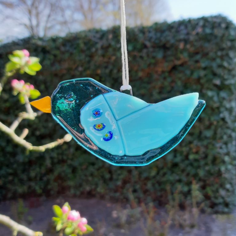 vogeltje, blauw, hangend.